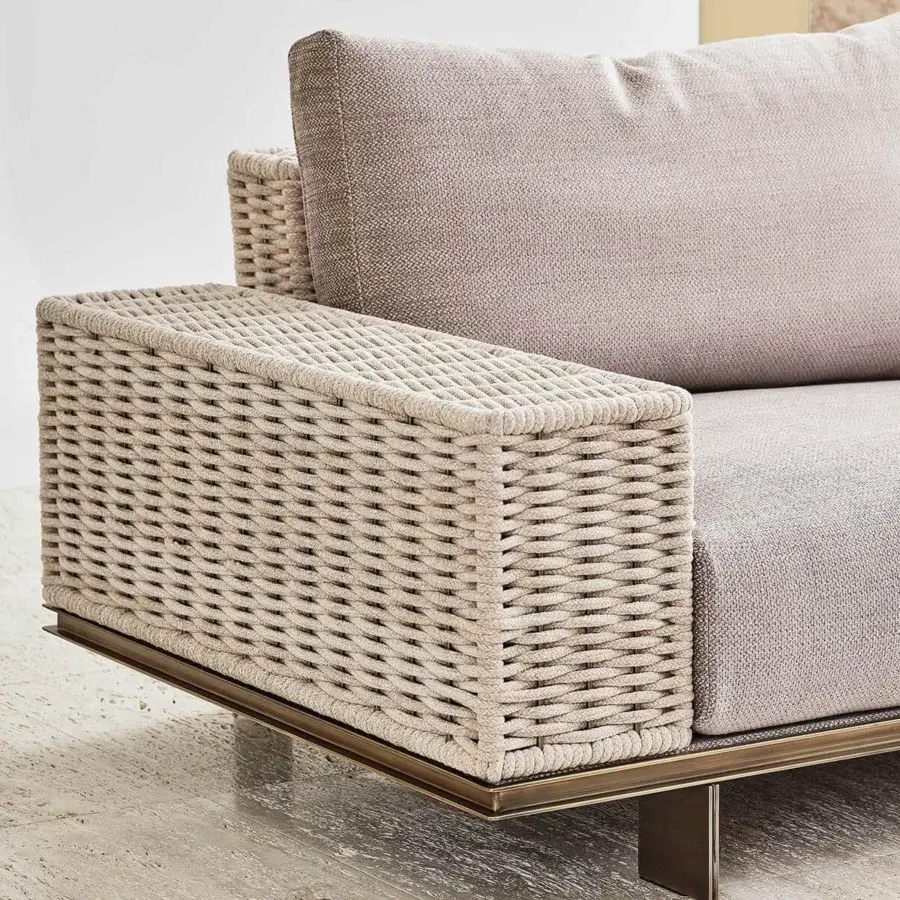 Elegant Rugiano Memphis sofa with light beige textile upholstery, braided velvet armrests and matte bronze metal base