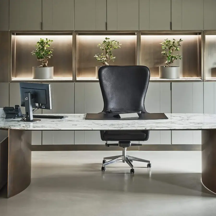 Superior Rugiano President desk with curved bronze legs supporting a marble-patterned tabletop in white and gray hues