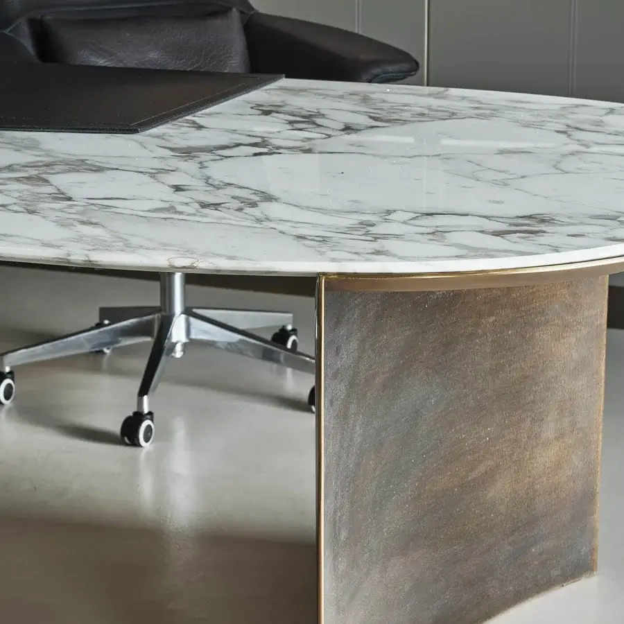 Distinguished Rugiano President desk with curved bronze legs and a rounded marble top in white and grey tones