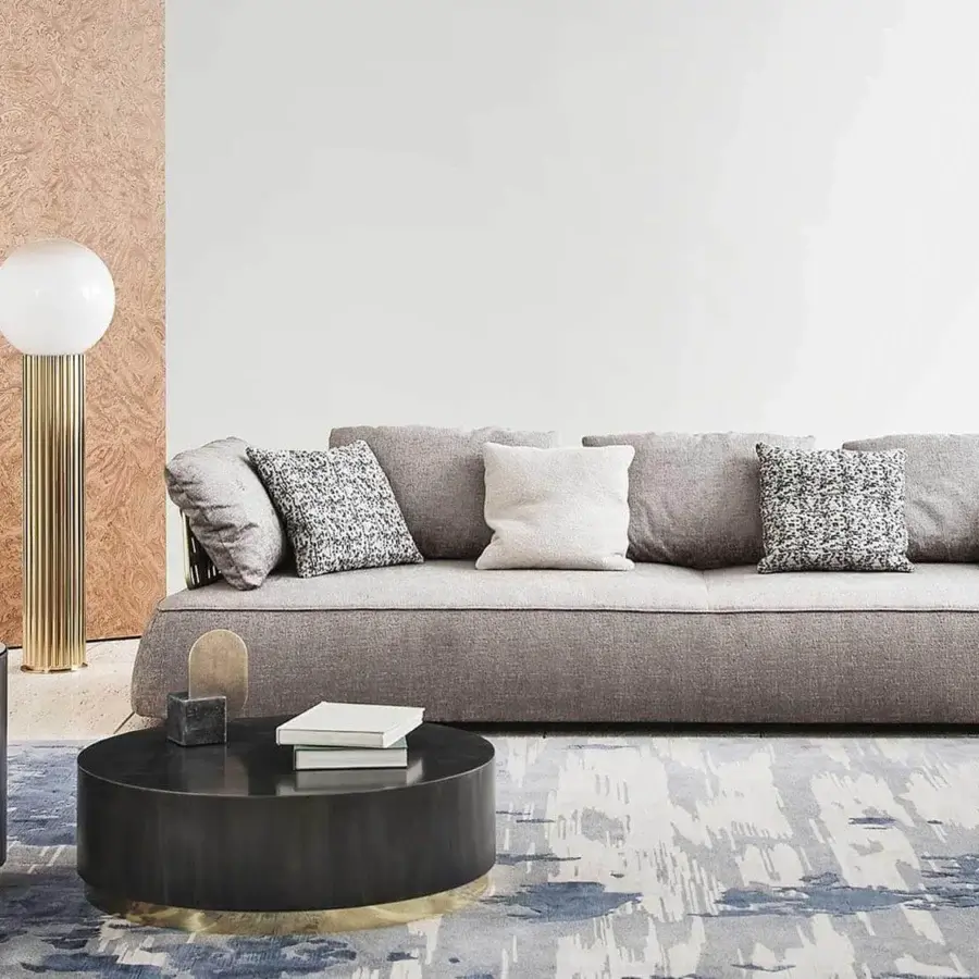 Distinguished Rugiano Genesi side table in flamed iron with glossy gold details and light gray surface