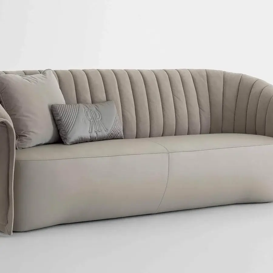 Captivating Rugiano Manta sofa with sinuous lines, neutral gray textile upholstery and bronze plinth base