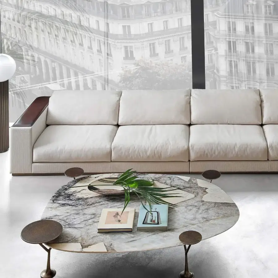 Distinguished Rugiano Bonsai coffee table with hammered bronze base and mottled stone-like surface in shades of white, gray, and beige