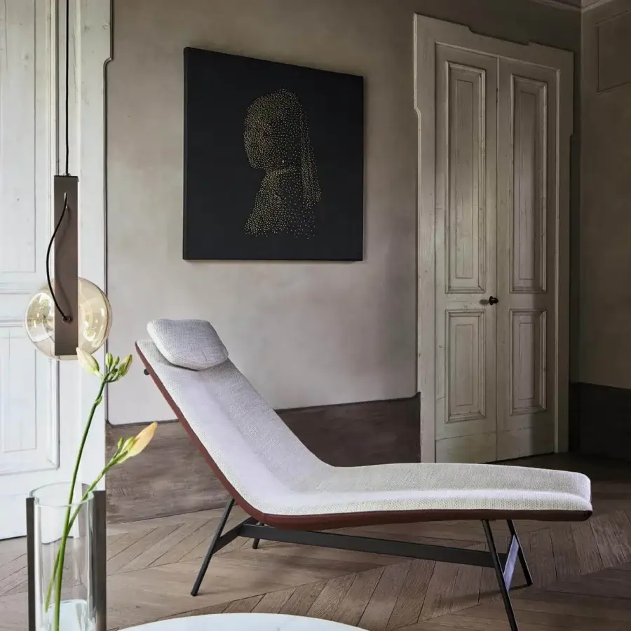 Distinguished Bonaldo Alpilles chaise lounge with light woven textile upholstery and brown leather detailing in a dark matte finish