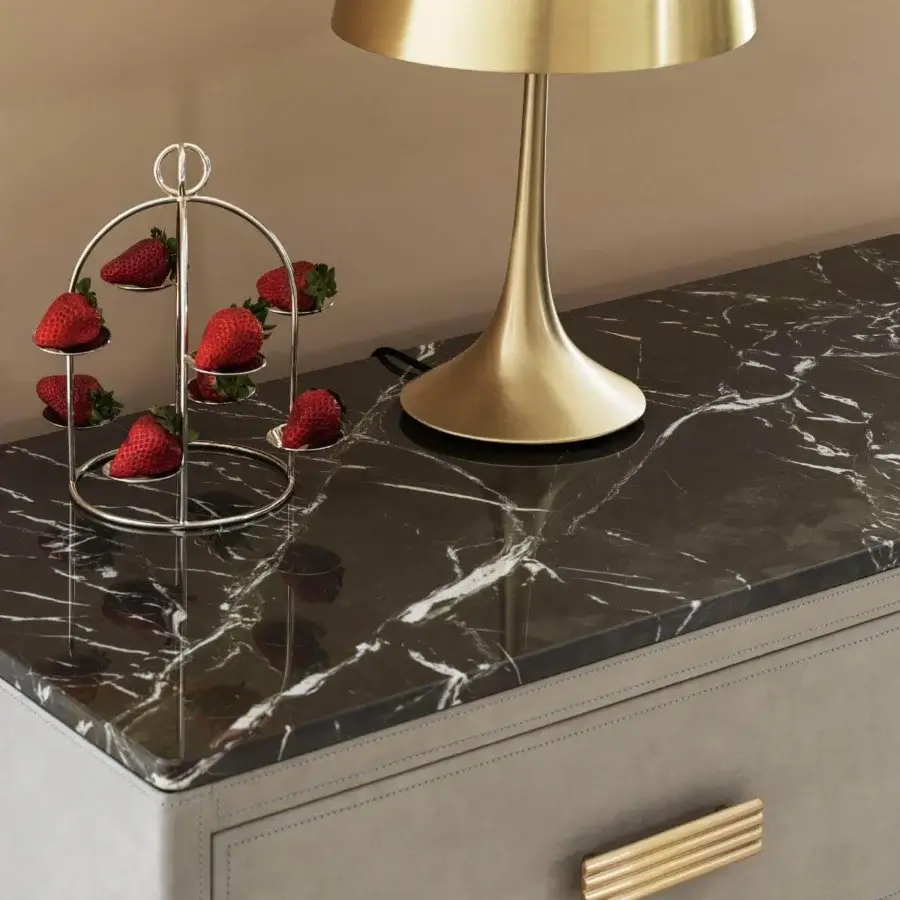 Distinguished Rugiano Rubik dresser with gray leather upholstery, blue stitchings and a black marble top crafted with refined brass details