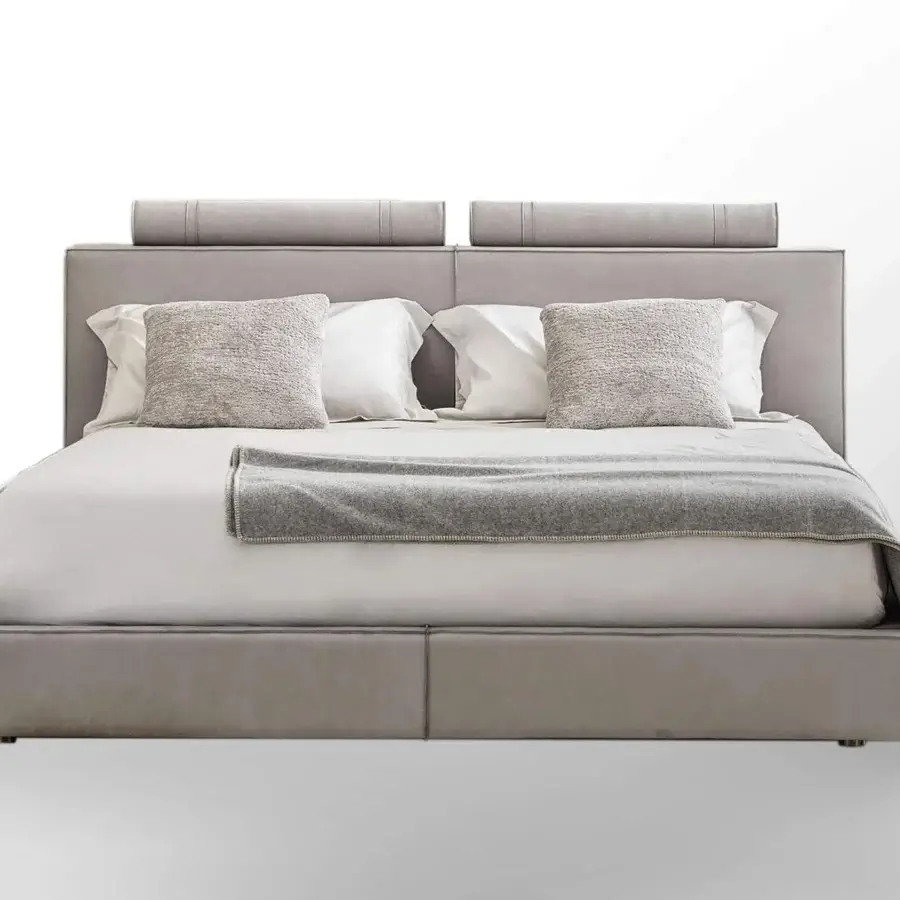 Distinguished Rugiano Rubik bed fully upholstered in light gray textile with cylindrical cushions and elegant metal accents