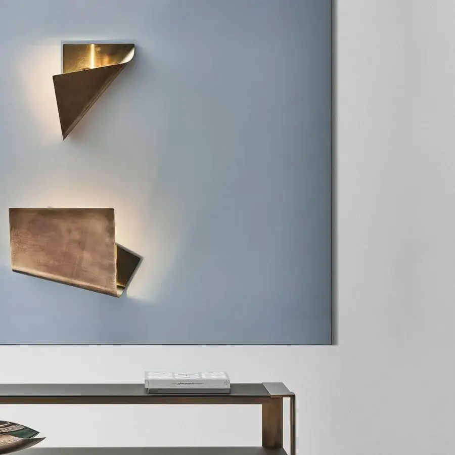 Exclusive Rugiano Leaf Wall Lamp with folded metal, brushed bronze and gold finish emitting a warm glow