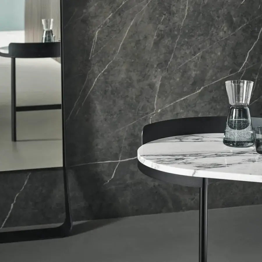 Superior Bonaldo Asia desk with round ceramic top exhibiting a white marble pattern and sleek black metal structure