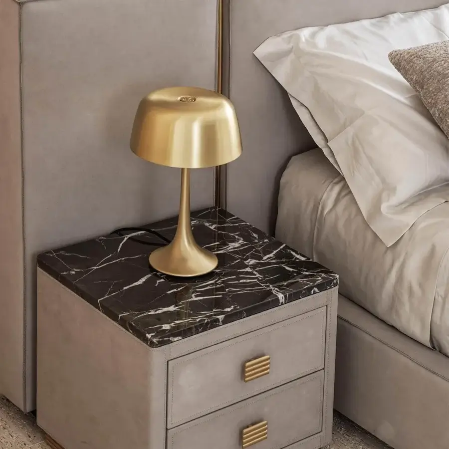 Distinguished Rugiano Wanda table lamp with metallic structure and glossy golden finish in rounded bell form