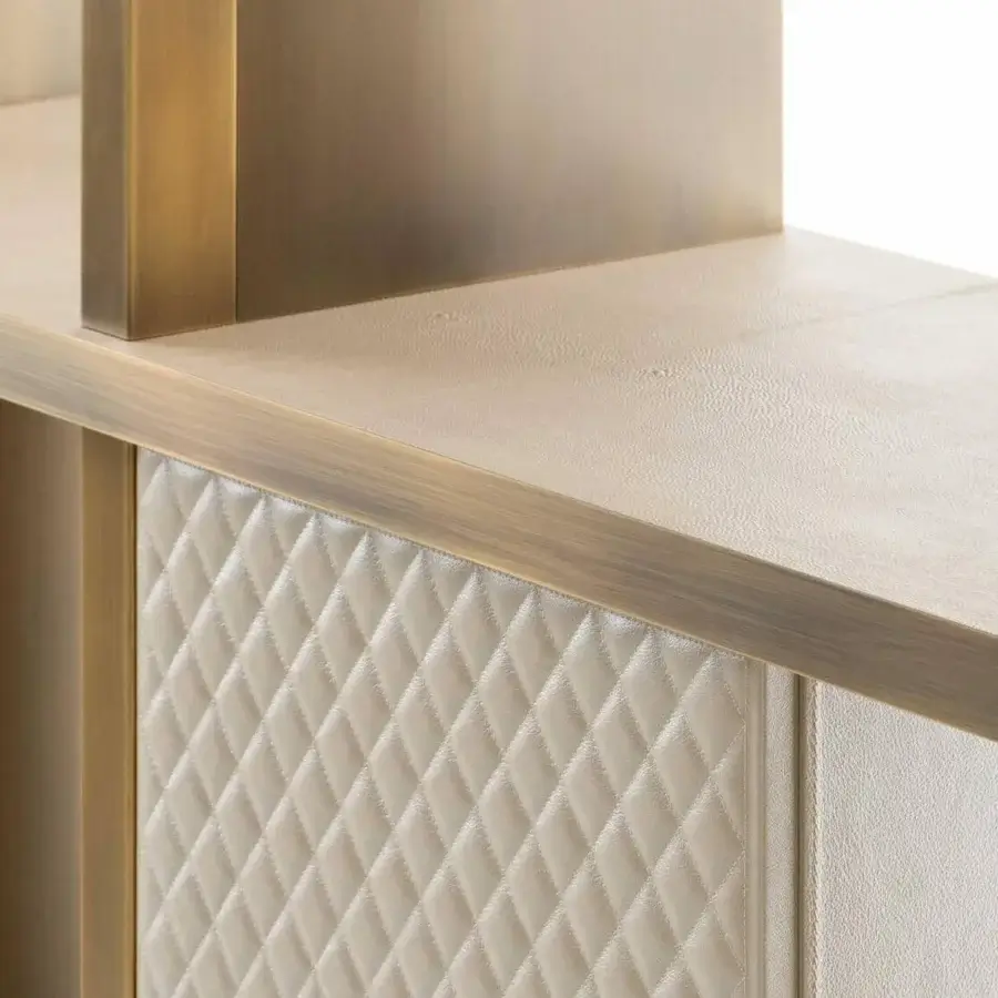 Distinguished Rugiano Asia bookcase with bronze finished metal structure and light beige leather shelves crafted with quilted side panels