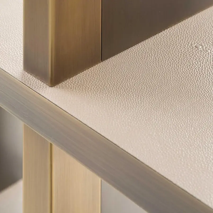 Sophisticated Rugiano Asia bookcase with bronze finished uprights and light beige refined leather shelves