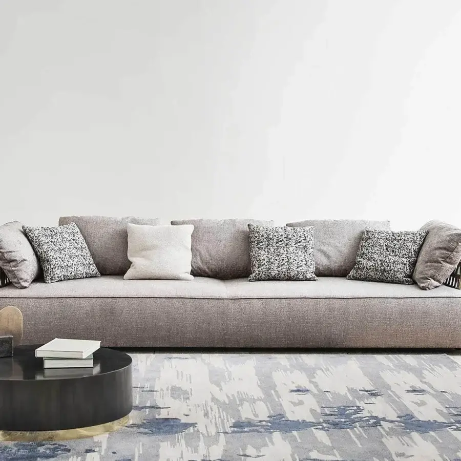 Exceptional Rugiano Melody sofa with woven metal armrests and backrests upholstered in light grayish-brown textile with a matte finish