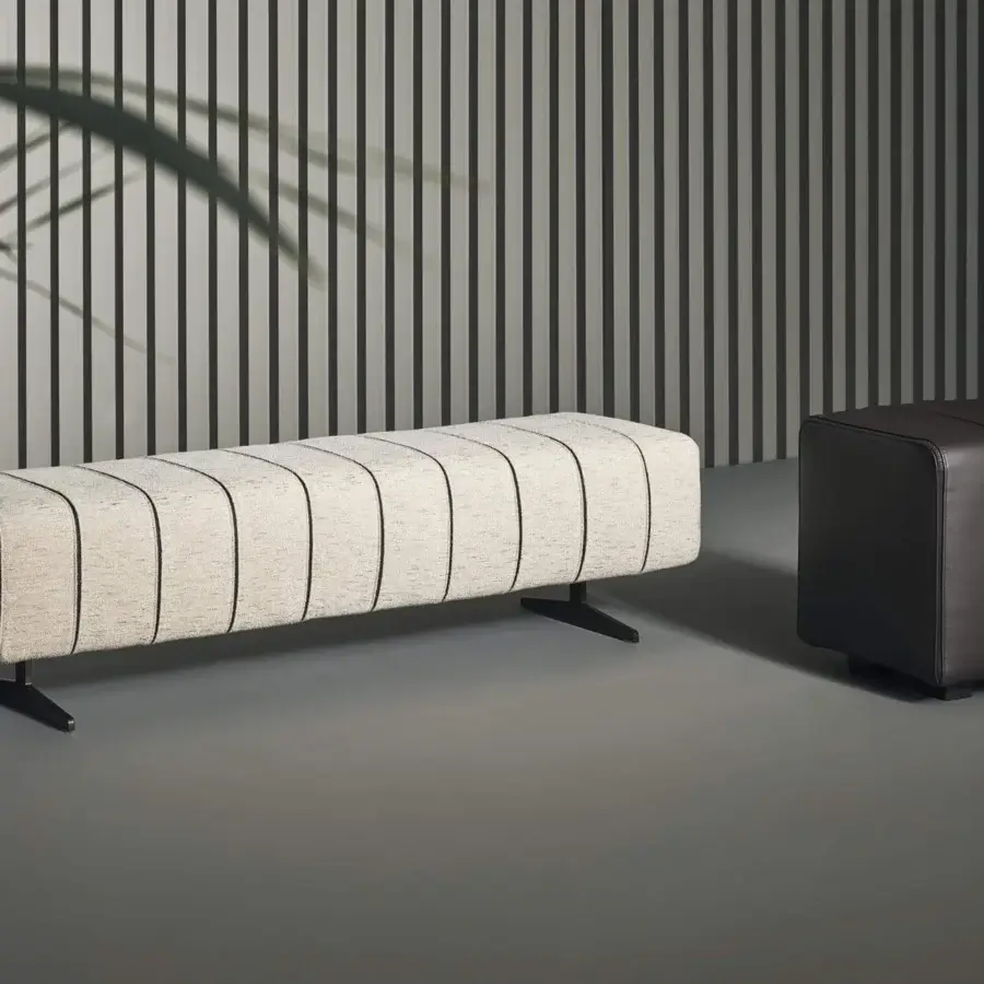 Exclusive Bonaldo Mark bench with light beige textured textile upholstery and precious leather inserts exhibiting stylish metal feet