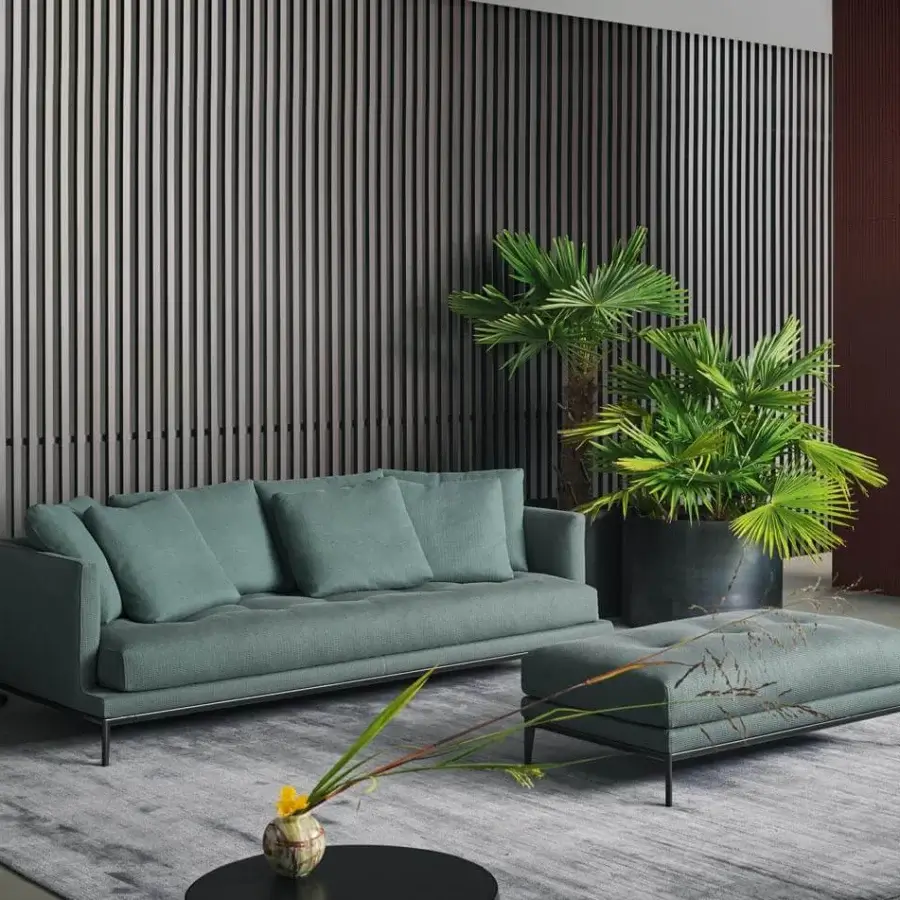 Exceptional Bonaldo Soft Island sofa with muted teal upholstery, deep tufting and a slender dark metal frame