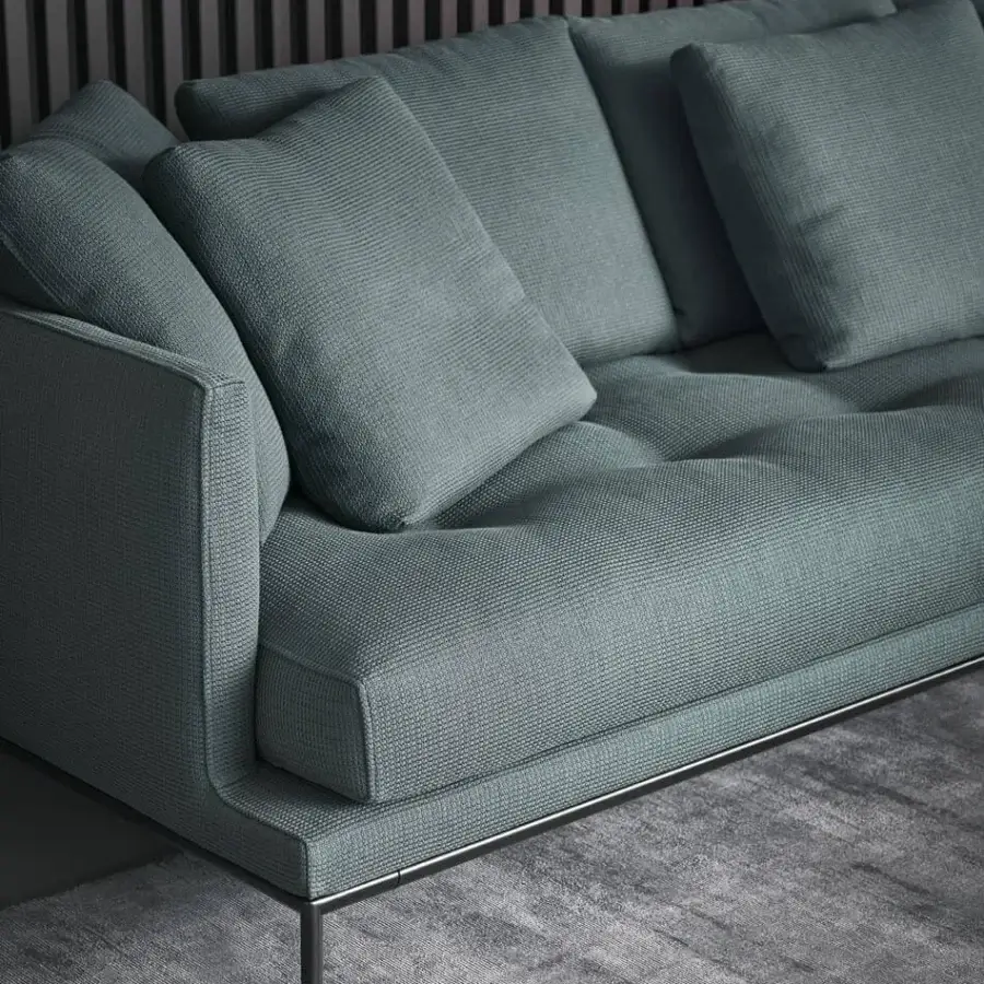 Superior Bonaldo Soft Island sofa with textured blue-gray textile, deep tufting and subtle dark metal feet