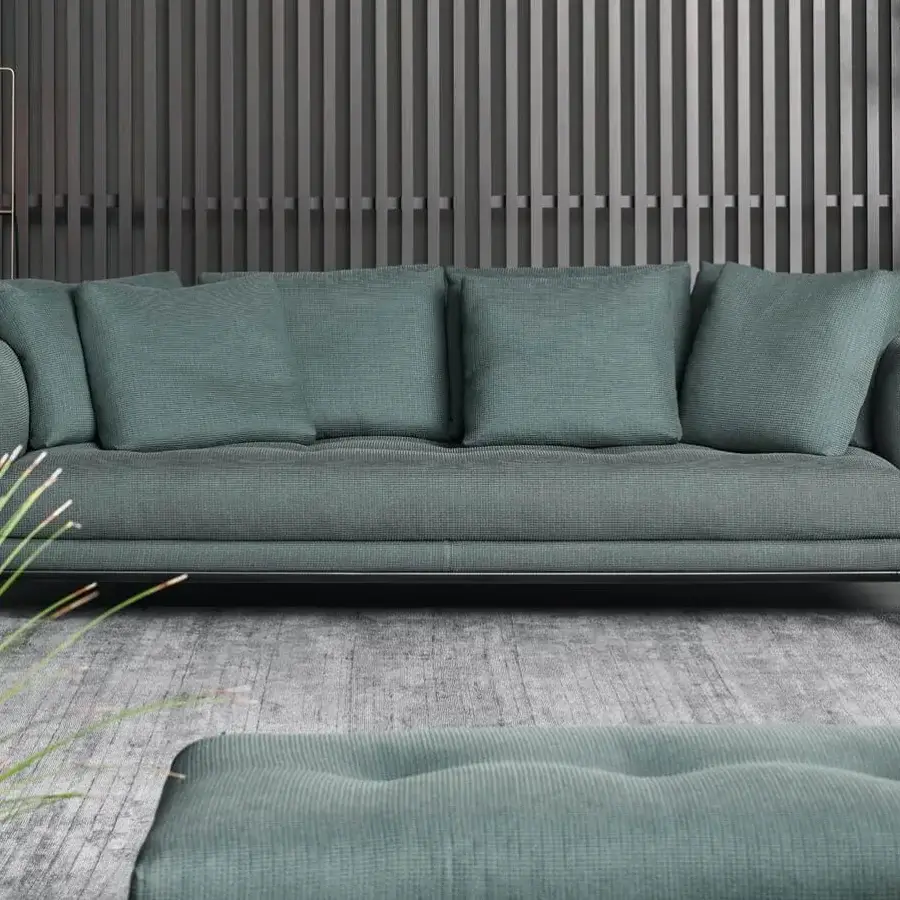 Elegant Bonaldo Soft Island sofa with woven teal upholstery, deep tufting and subtle dark metal framework