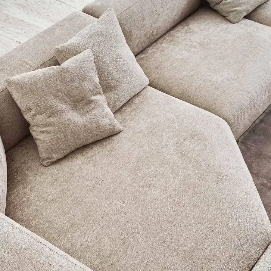 Superior Rugiano Boheme sectional with a metal base, light beige textile upholstery and a textured matte finish