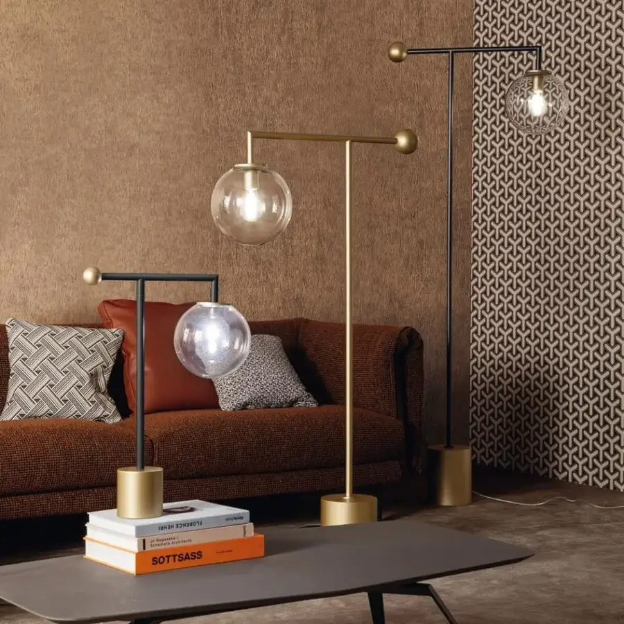 Superior Bonaldo Bardot floor lamp with geometric black metal structure and matte brass base in transparent glass