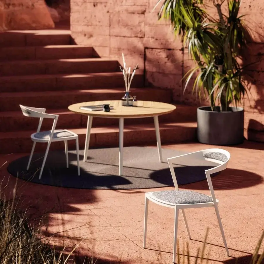 Innovative Royal Botania Styletto chair with sleek white aluminum framing and gray textile padding for comfortable outdoor use