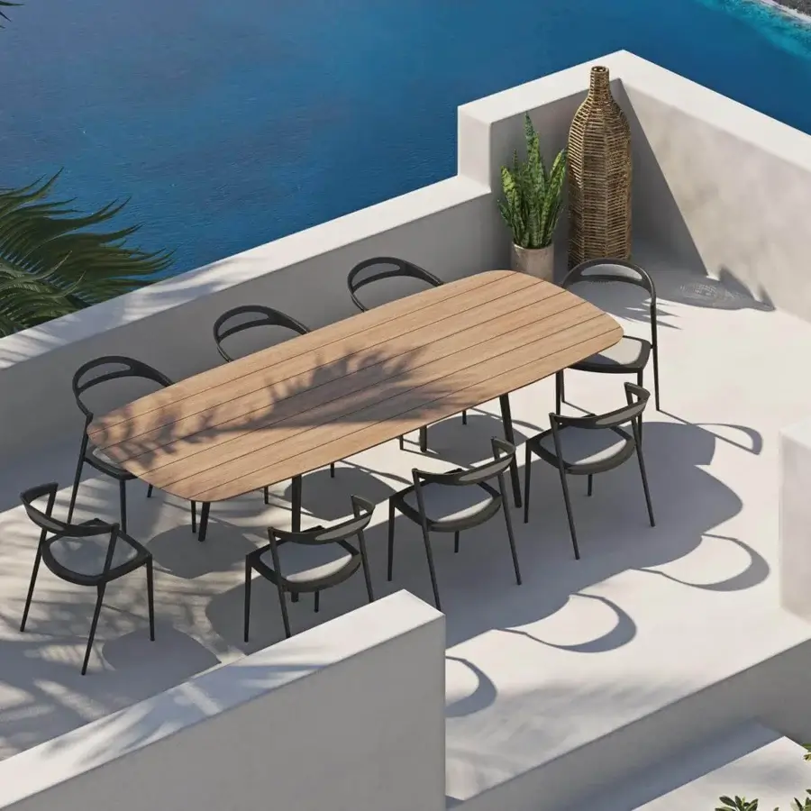 Sophisticated Royal Botania Styletto table built with teak wood slats and dark-toned coated aluminum legs in a matte finish
