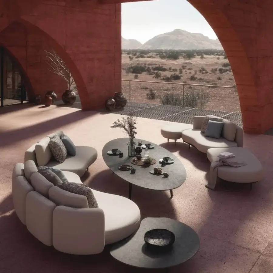 Superior Royal Botania Styletto coffee table with round ceramic top and sleek tapered legs in dark gray matte finish