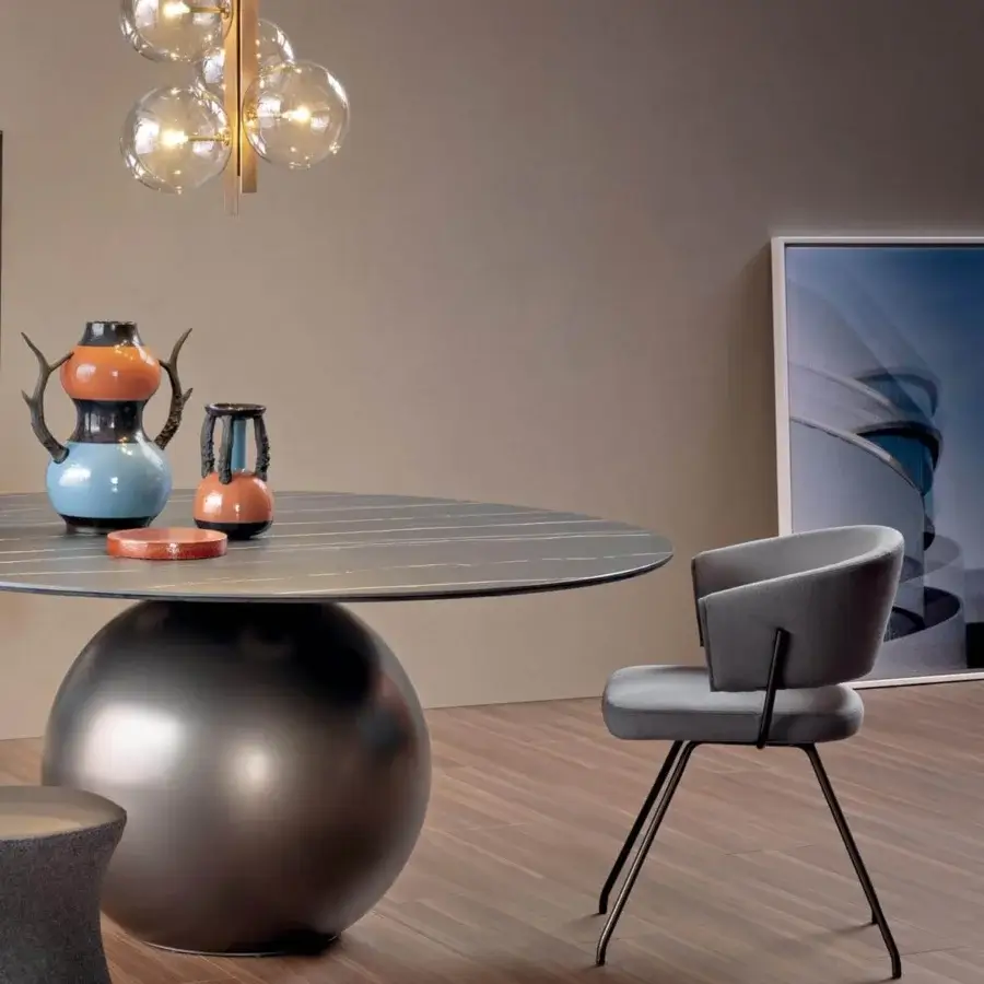 Elegant Bonaldo Bahia armchair in smooth gray textile with outwardly flexing black metal legs
