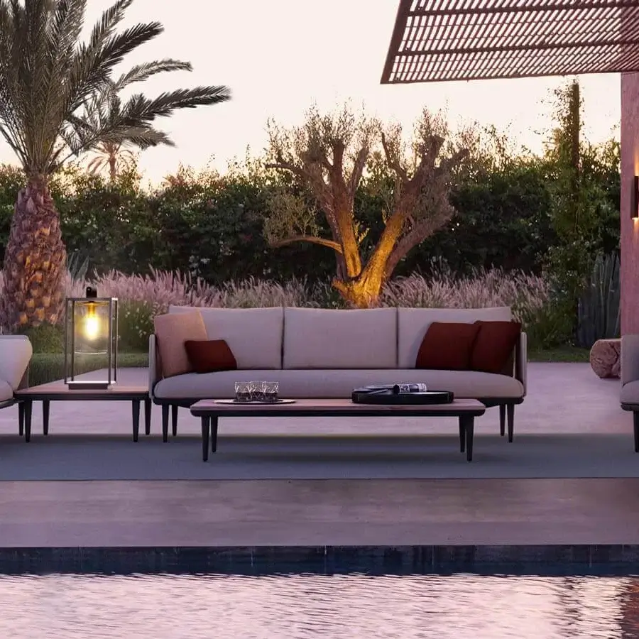 Distinguished Royal Botania Styletto Lounge sectional with light beige textile and dark reddish-brown cushions, built with teak and metal framing