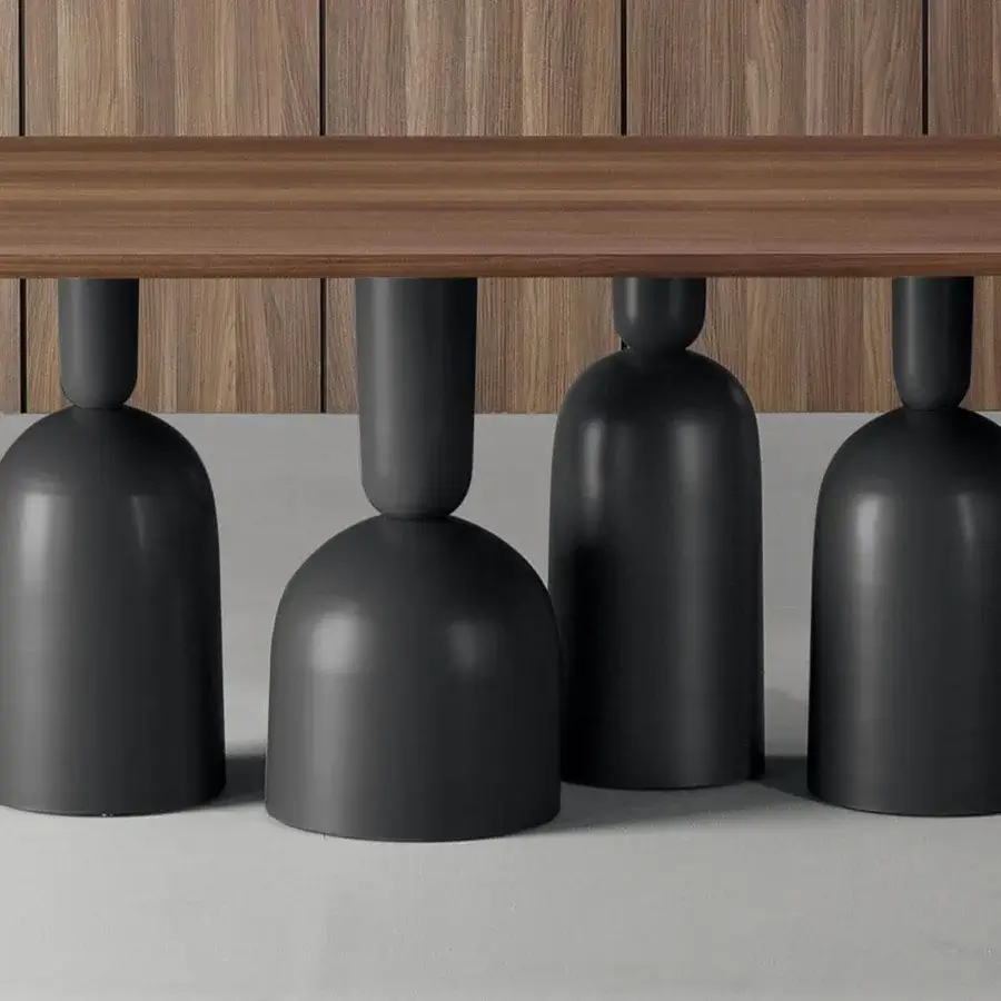 Distinguished Bonaldo Cop table with a rounded wood top and black metal base crafted in stacked shapes with a smooth finish