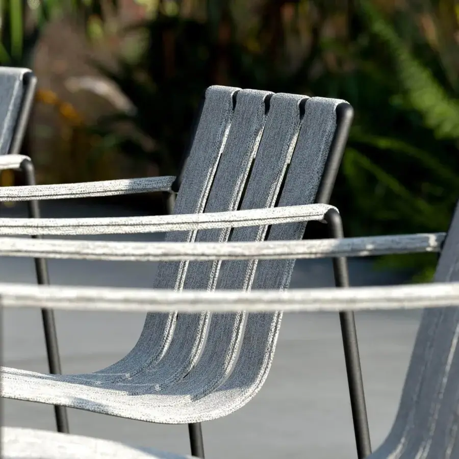 Sophisticated Royal Botania Strappy armchair with light gray padded straps and dark coated stainless steel framework