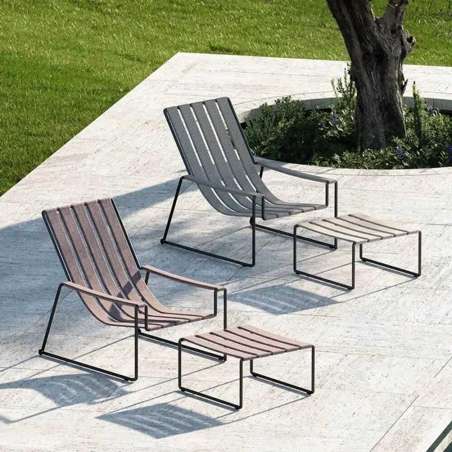 Exclusive Royal Botania Strappy lounger with woven straps and a light brown seat built with a coated stainless steel frame