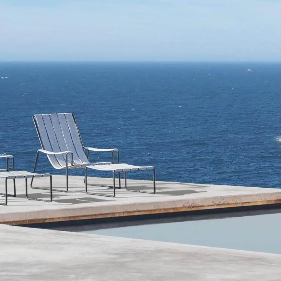 Exceptional Royal Botania Strappy lounger with a coated stainless steel frame and light gray strappy seat in a matte finish