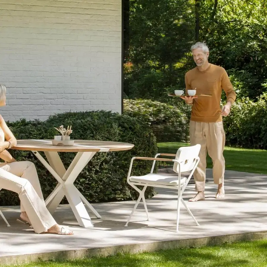 Sophisticated Royal Botania Traverse table with smooth teak wood top and light matte coated aluminum base