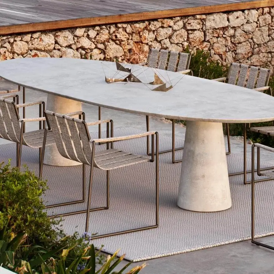 Exceptional Royal Botania Conix table with light gray fibre-reinforced Ductal® concrete and a polished treated surface