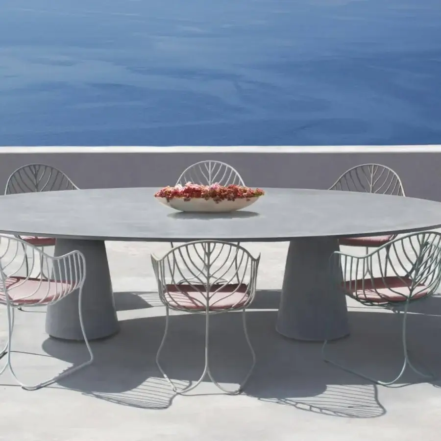 Distinguished Royal Botania Conix table built with polished fibre-reinforced Ductal® concrete and oval gray top