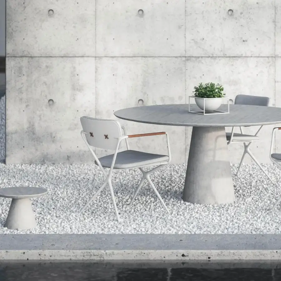 Distinguished Royal Botania Conix table crafted with fibre-reinforced Ductal® concrete and a polished matte gray finish