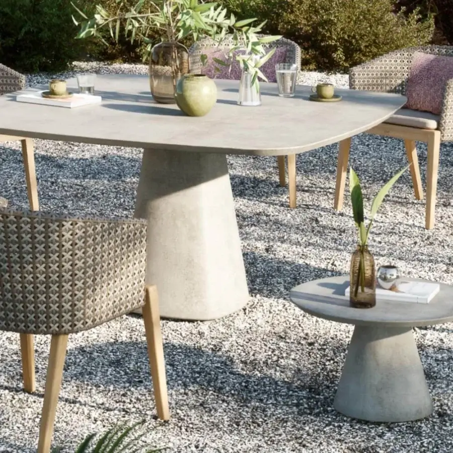 Elegant Royal Botania Conix side table with conical base and round top crafted in light gray matte Ductal® concrete