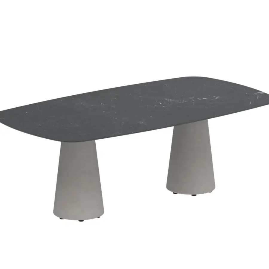 Distinguished Royal Botania Conix table with a dark, marble-like concrete top and light gray, textured Ductal® concrete conical bases