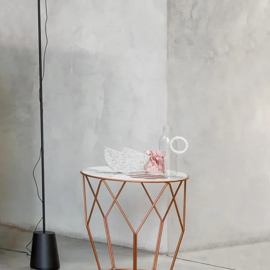 Exceptional Bonaldo Arbor coffee table with curved metal rods in a glossy copper tone and a smooth white speckled top