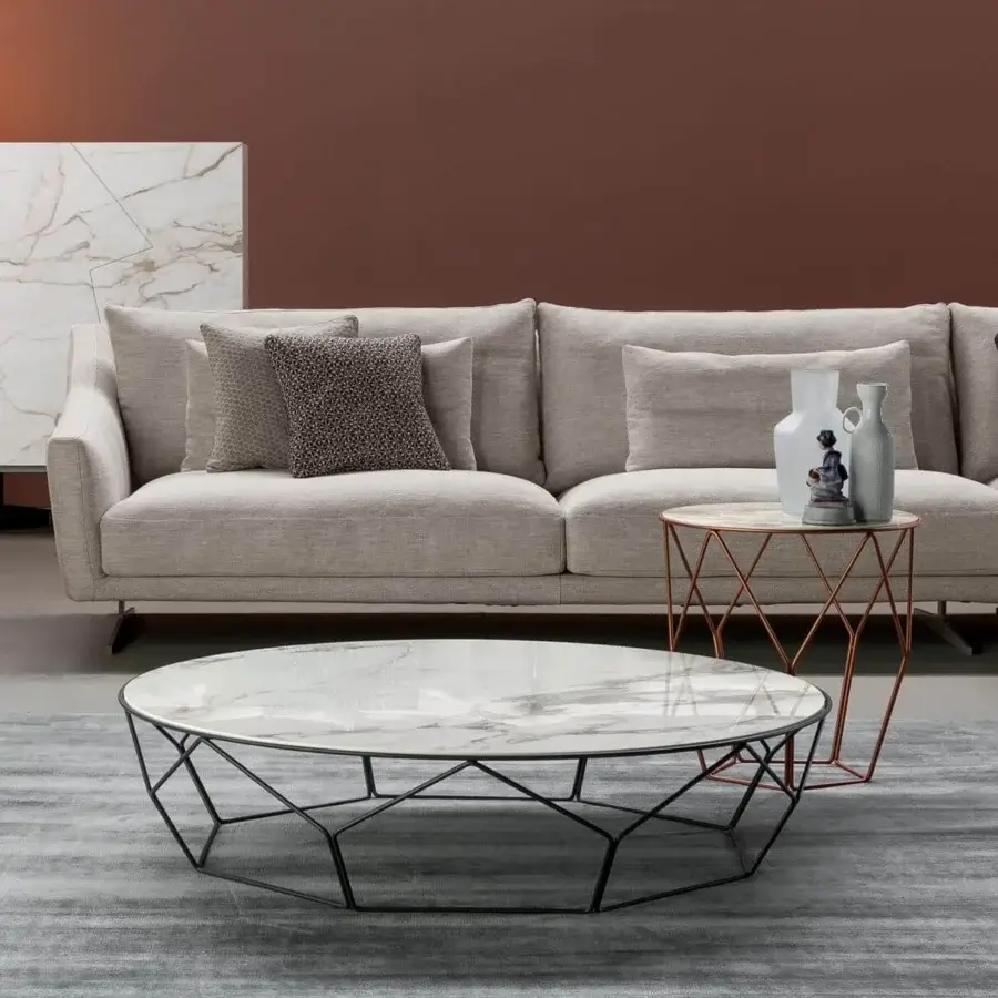 Elegant Bonaldo Arbor coffee table with a white marble-like top and matte black curved metal base