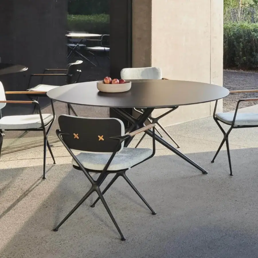 Captivating Royal Botania Exes table with dark matte ceramic top and intersecting coated aluminum legs