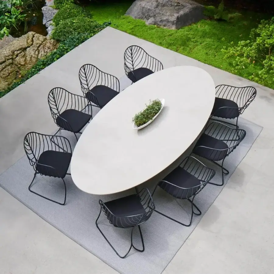 Distinguished Royal Botania Exes table with sleek light beige ceramic top and coated aluminum base