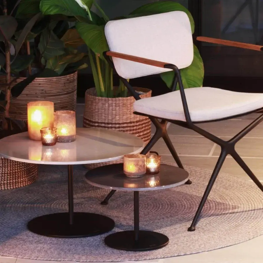 Elegant Royal Botania Butler side table with coated stainless steel base in matte black and dark gray circular tabletop