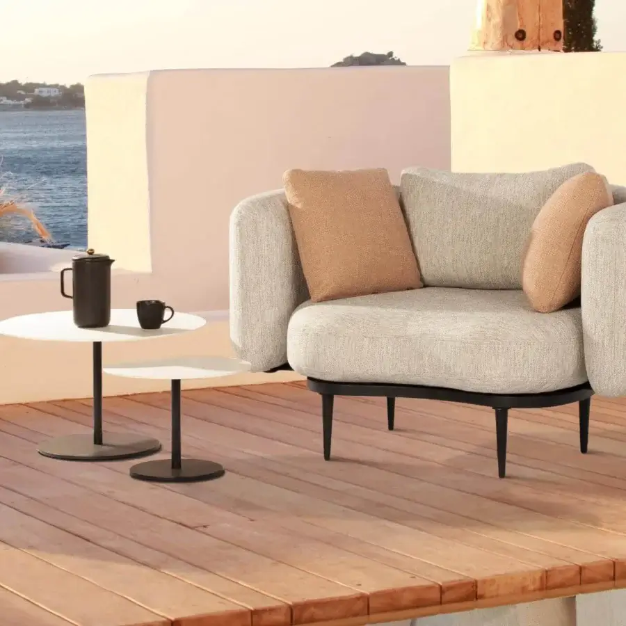 Distinguished Royal Botania Butler side table with white enameled lava stone tabletops and sleek coated stainless steel base in black finish