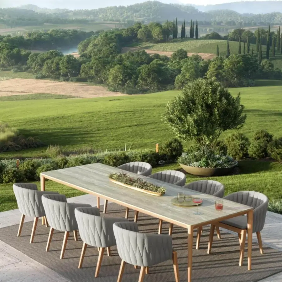 Elegant Royal Botania Calypso armchair with quilted gray textile and light-colored teak with a detachable stainless steel backrest