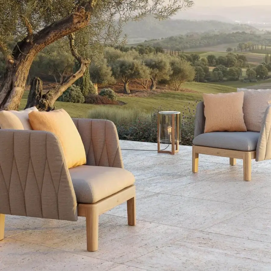 Sophisticated Royal Botania Calypso lounge chair with quilted light grey textile and stainless steel, built with a light matte teak base