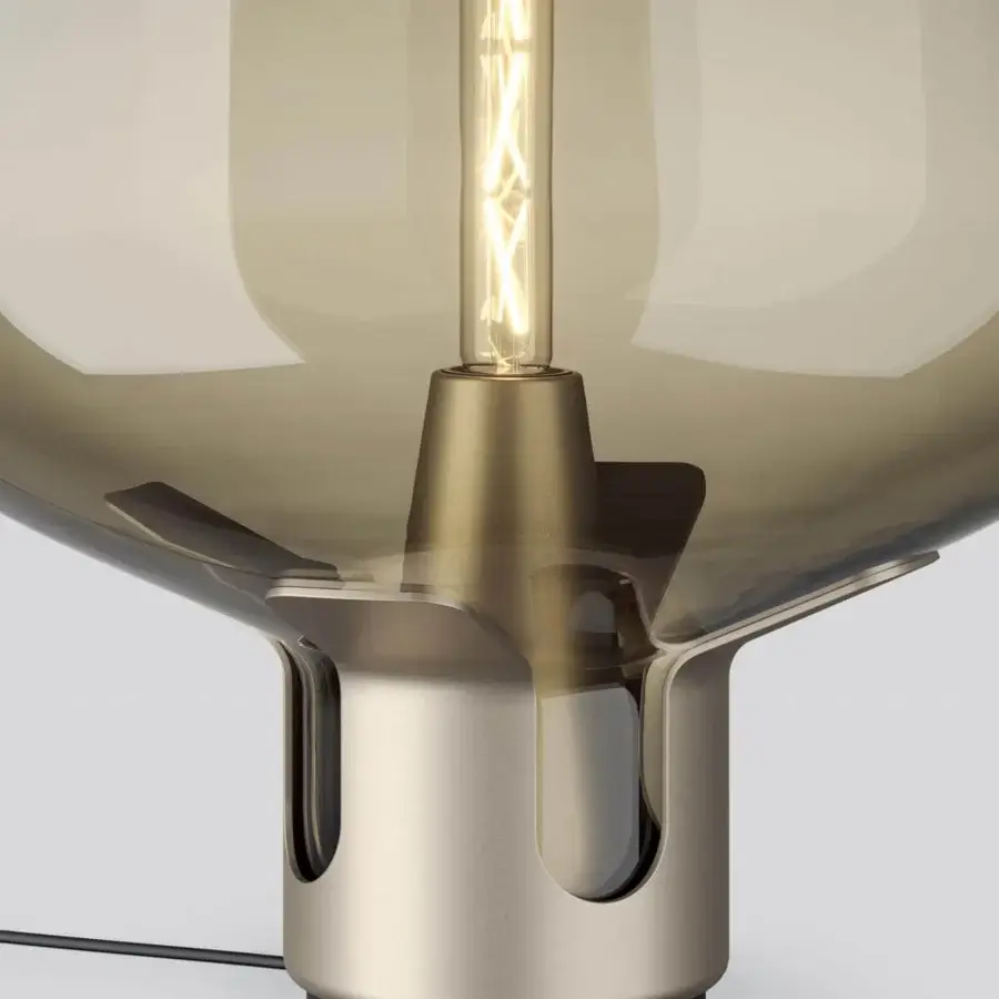 Elegant Lodes Flar table lamp in smoky brownish-gray blown glass with a brassy conical metallic base and matte finish
