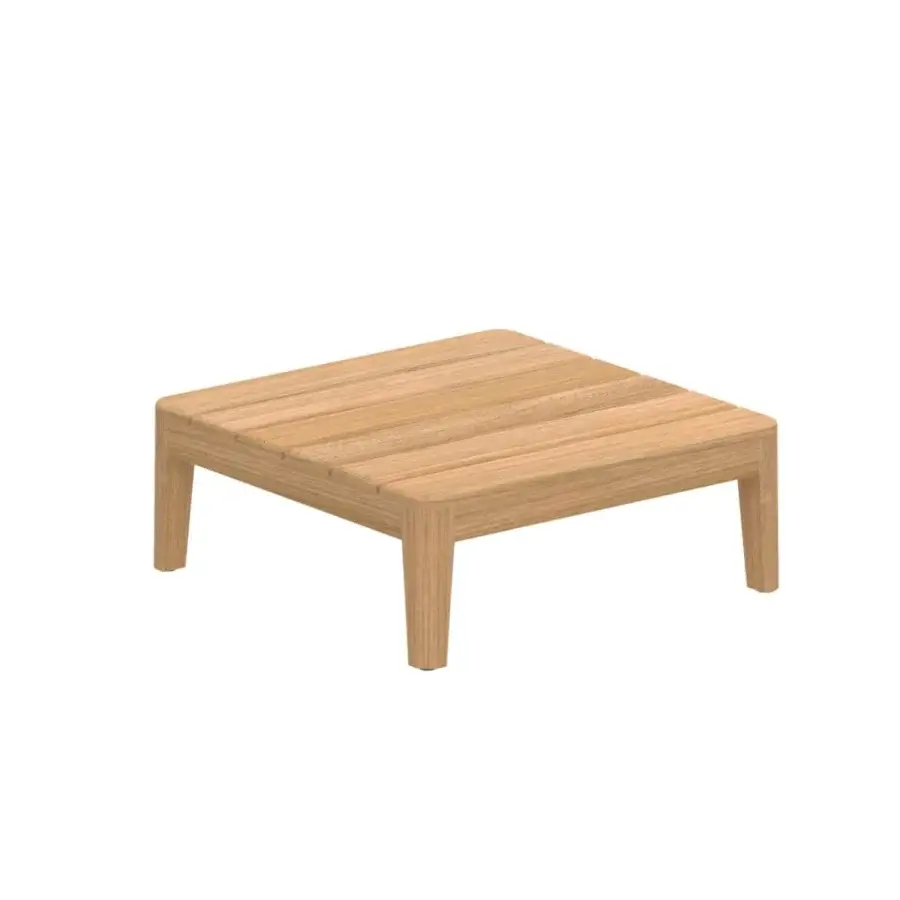 Distinguished Royal Botania Calypso lounge coffee table built in teak wood with a smooth light brown finish and seamless legs