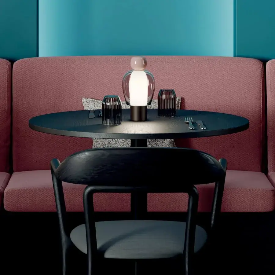 Captivating Lodes Easy Peasy table lamp with stacked blown glass and a matte dark brown metal base, accented with a pale pinkish hue