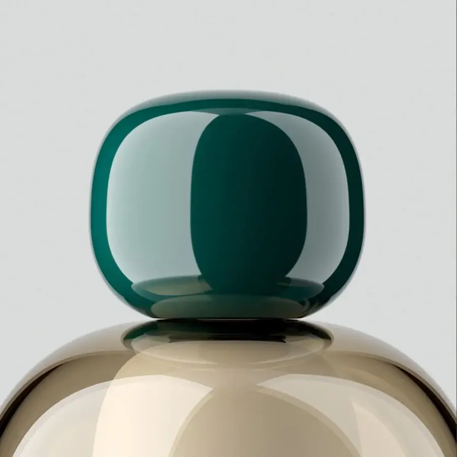 Superior Lodes Easy Peasy table lamp with a sculptural form in light tan and glossy dark green technopolymer