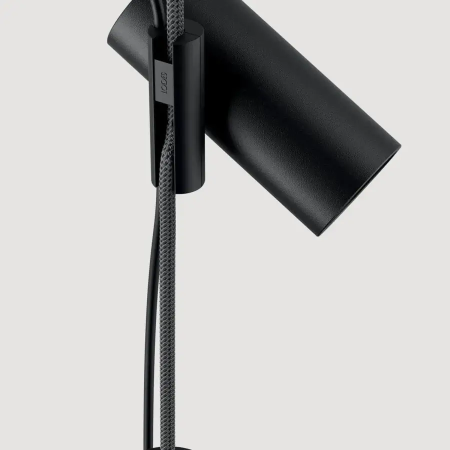 Exceptional Lodes Cima floor lamp with a cylindrical matte black metal structure and braided gray rope detail