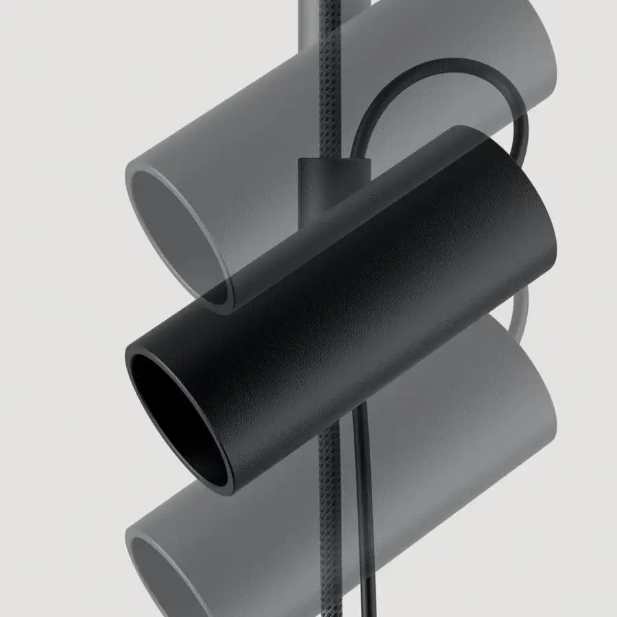 Superior Lodes Cima lamp with cylindrical light gray and black shades suspended from a black nautical rope structure